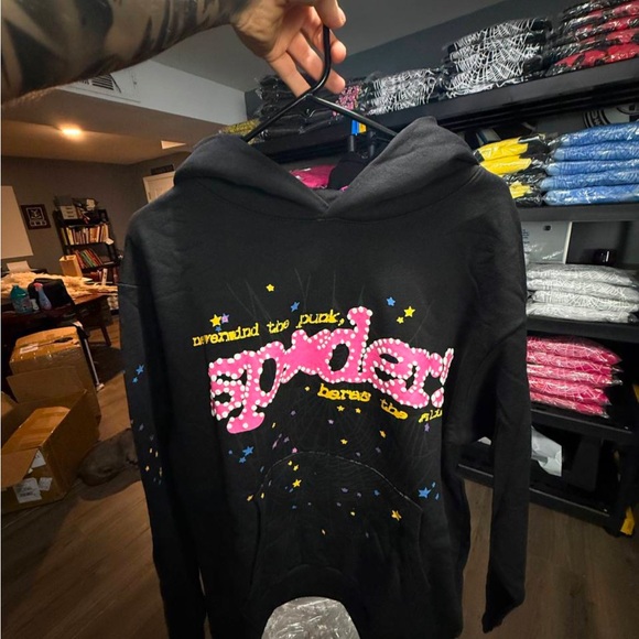 SP5DER Black Hoodie with Pink Graphic